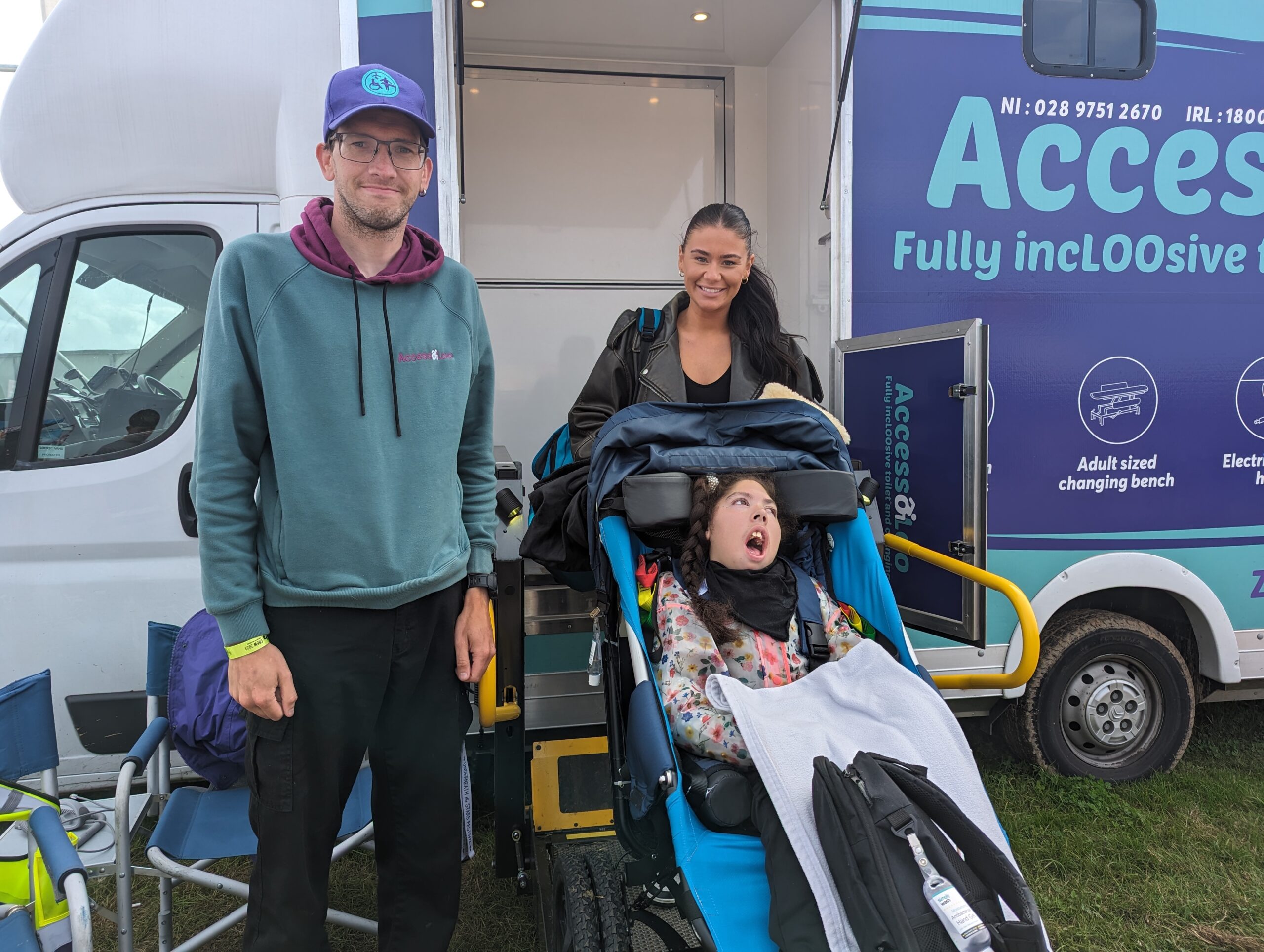 Martin and a family who have been using the AccessoLoo pictured outside AccessoLoo Francesca