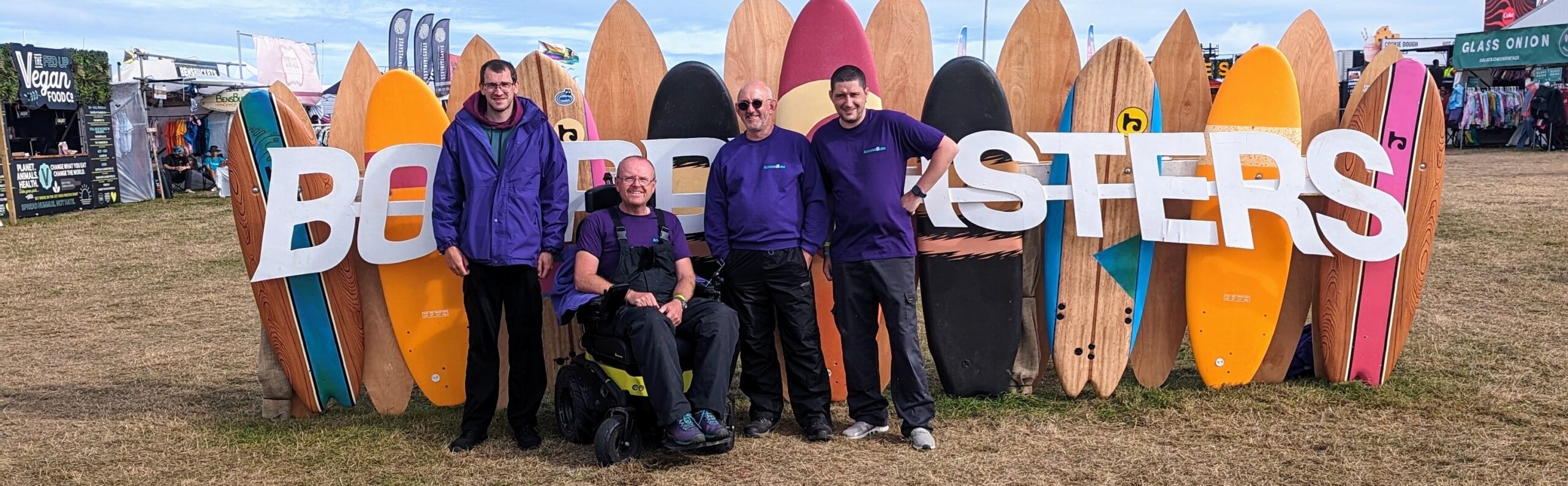 Staff members Infront of the Boarmasters livery at the festival that takes place every year in Cornwall.