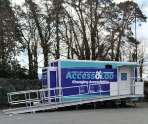 AccessoLoo James set up and ready for use. James is a trailer AccessoLoo with an access ramp deployed in front.
